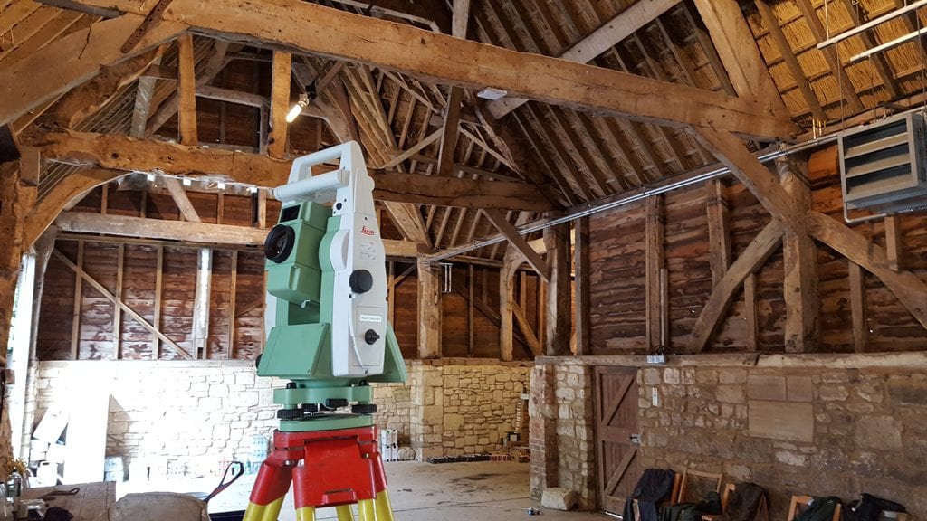 Hampshire Land surveys in an old barn using land surveyor equipment.